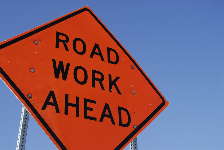 Road crew repairing pavement on a city street