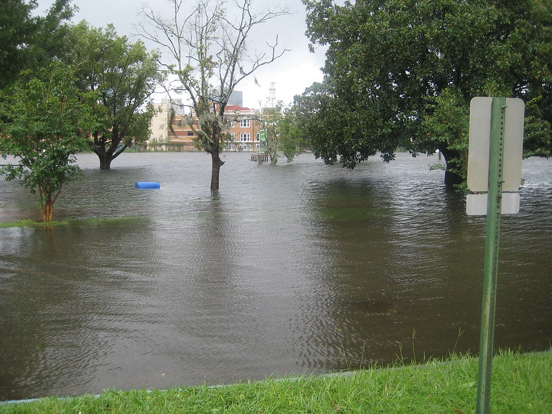 A riverfront park submerged by storm water